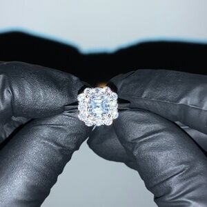 STERLING SILVER MOISSANITE SOLITAIRE W SURROUNDING MULTI STONE